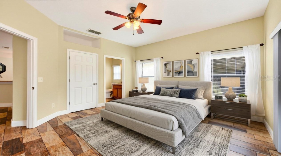 Bedroom 2 features its own EN-SUITE BATH, making it an excellent option for MULTI-GENERATIONAL LIVING or guests seeking additional privacy. Virtually Staged