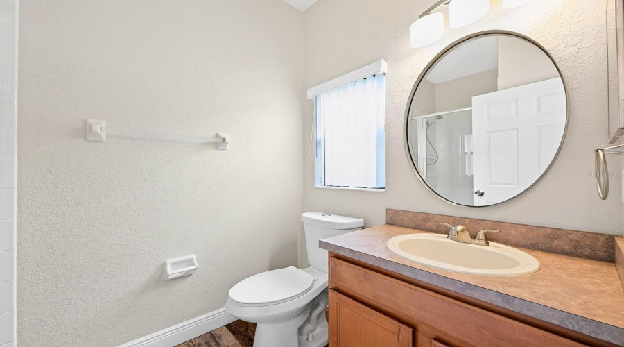 Bedroom 2 features its own EN-SUITE BATH, making it an excellent option for MULTI-GENERATIONAL LIVING or guests seeking additional privacy.