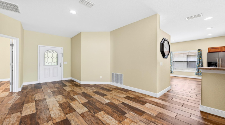 Inside, you'll immediately appreciate the warmth and easy maintenance of BEAUTIFUL WOOD-LOOK TILE FLOORING throughout.