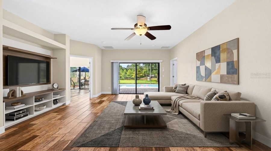The spacious Living Room, adjacent to the Kitchen, provides a comfortable gathering space. Virtually Staged