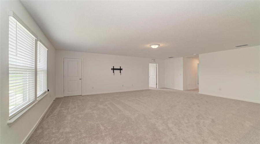 Loft Upstairs With Closet And Tv Mounting Hardware