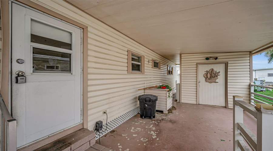 Carport / Door Entry Area. Shed Is Straight Ahead Where Laundry Is Located