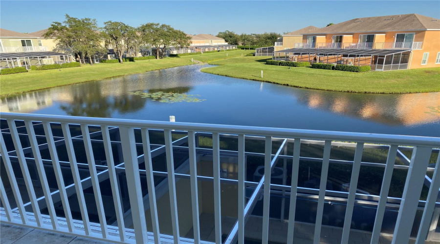 Peaceful View From The Oversized Balcony Overlooking The Pond And Surrounding Greenery.