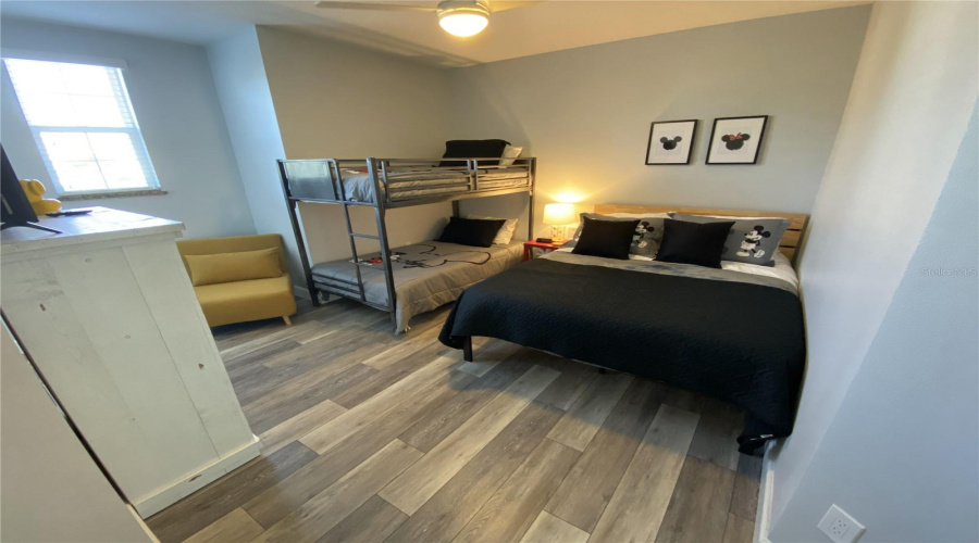 Kids Room With A Full Bed And Two Twin Size