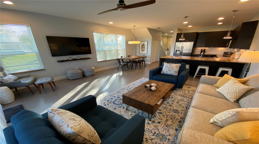 Spacious Open-Concept Living, Dining, And Kitchen Area Featuring Modern Finishes, Tile Flooring, And Plenty Of Room For Gathering.