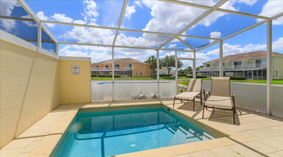Private Pool Overlooking The Pond And Surrounding Resort-Style Community Landscaping.