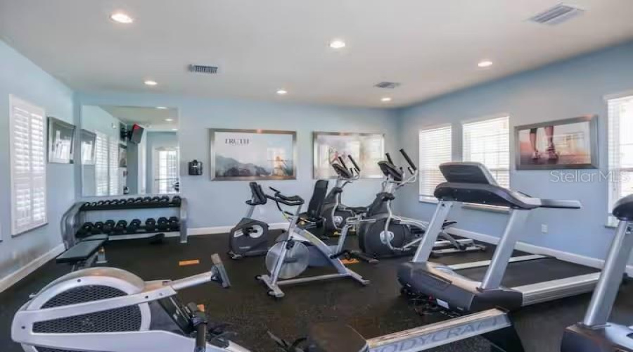 Community Fitness Center Featuring Cardio And Strength-Training Equipment For Residents And Guests To Enjoy.