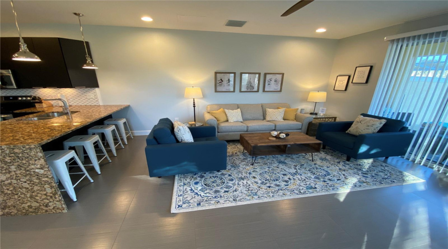Comfortable Living Space Seamlessly Connected To The Kitchen, With Breakfast-Bar Seating And An Open Layout Ideal For Entertaining.