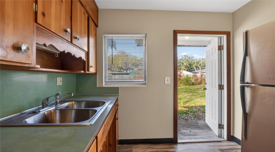 Kitchen And Door To The Back Yard