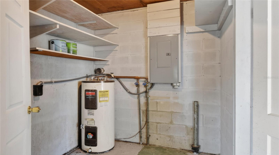 Laundry Room Inside Which Has A Door To The Carport