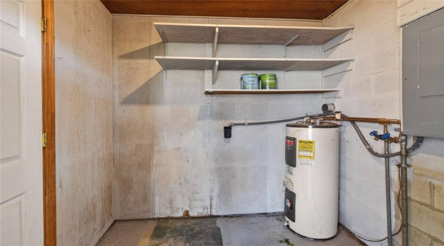 Laundry Room Inside Which Has A Door To The Carport