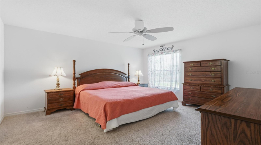 Primary Bedroom With King Bed And Dressers