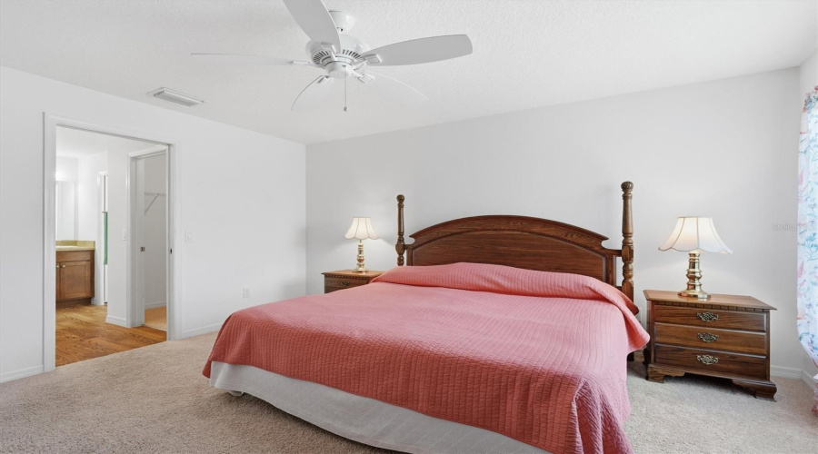 Primary Bedroom With King Bed And Dressers