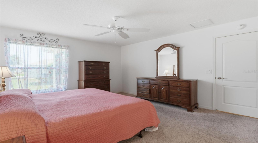 Primary Bedroom With King Bed And Dressers