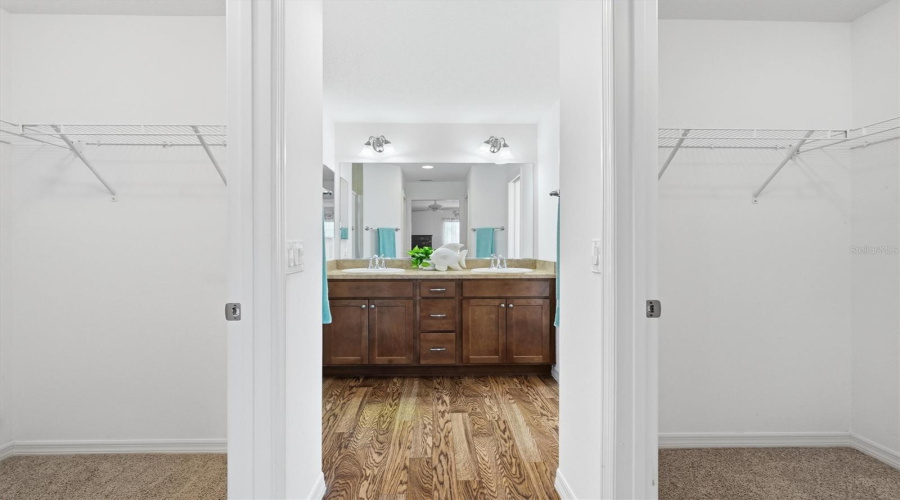 Primary Bathroom With Dual Walk In Closets
