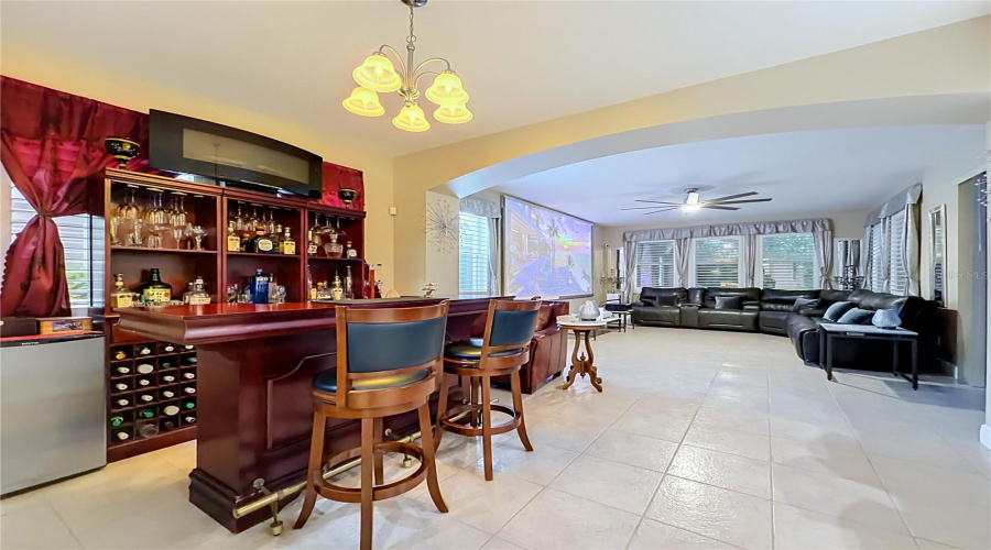 Dining Area Off Kitchen, Space Is Currently Used As A Home Bar, Opening To The Great Room And Access To Screen Enclosed Paver Patio.
