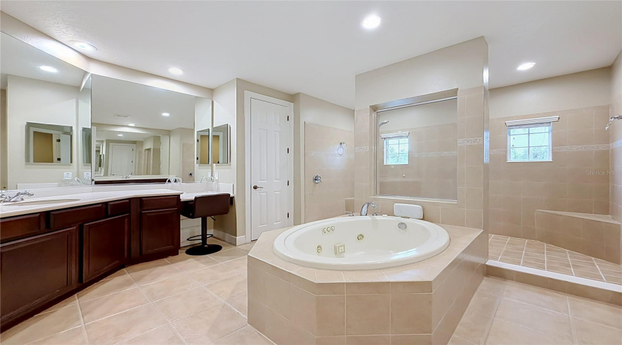 Massive Ensuite, Center Jetted Tub, Dual Vanities, Large Separate Showing W/Multiple Shower Heads And Bench.