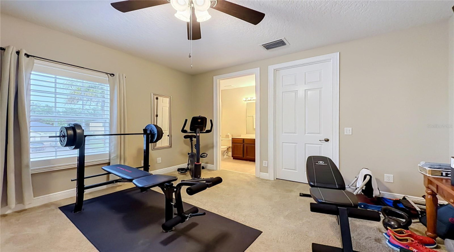 Bedroom 4 With Full Ensuite Bath And Walk-In Closet, Plantation Shutters, Currently Used As A Workout Space.