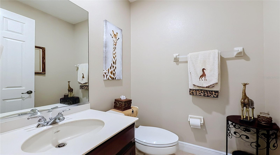 1/2 Bath Off Wet Bar Area Downstairs.