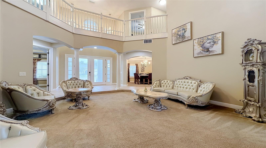 Double Door Entry Foyer, Formal Living Area, Soaring Ceilings, Architectural Features.