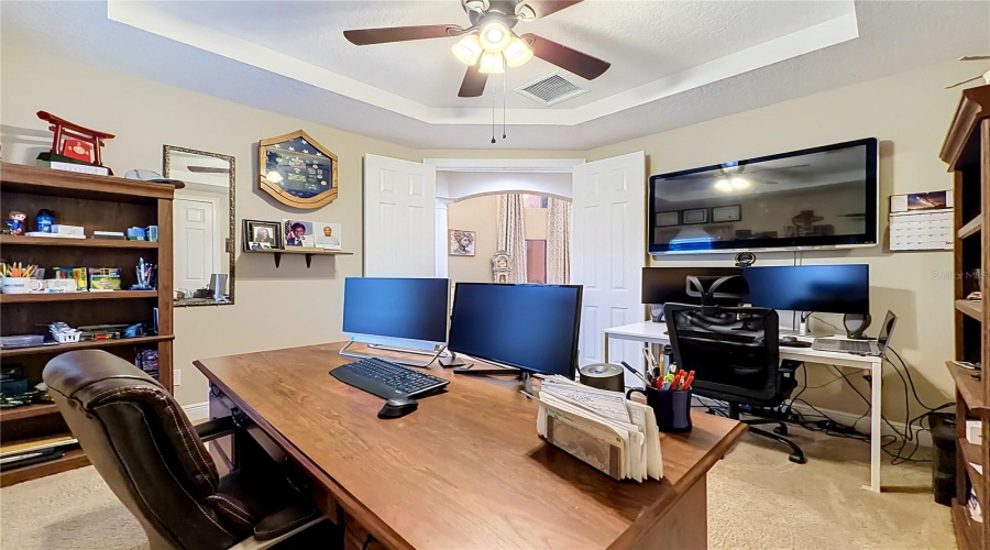 Downstairs Bedroom 6/Den/Office/Flex Space. Tray Ceiling, View Towards Formal Living Area.