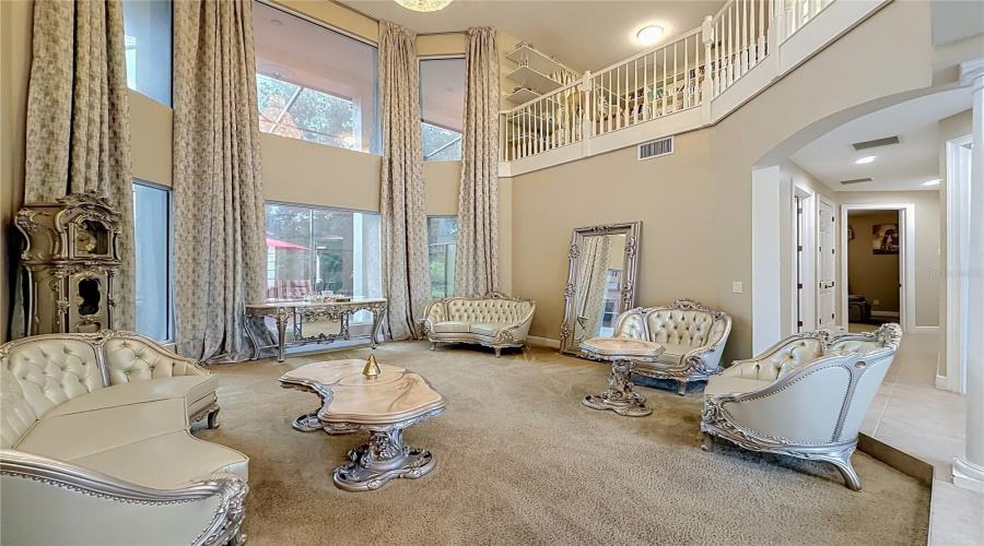 Formal Living Area, Soaring Ceilings, Floor To Ceiling Picture Windows, Loft/Library Upstairs.