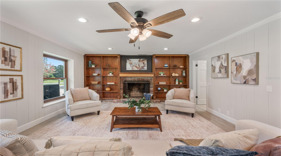 Family Room With Built-In Shelving And Fireplace