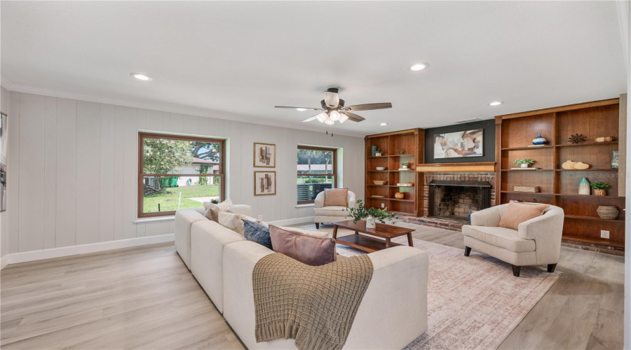 Family Room With Built-In Shelving And Fireplace