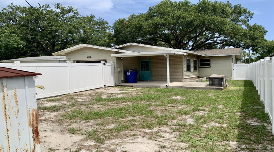 Fenced Back Yard With Covered Lanai