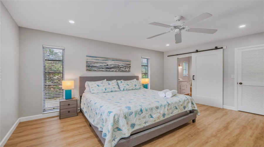 Primary Bedroom With Ensuite Bathroom And Walk-In Closet