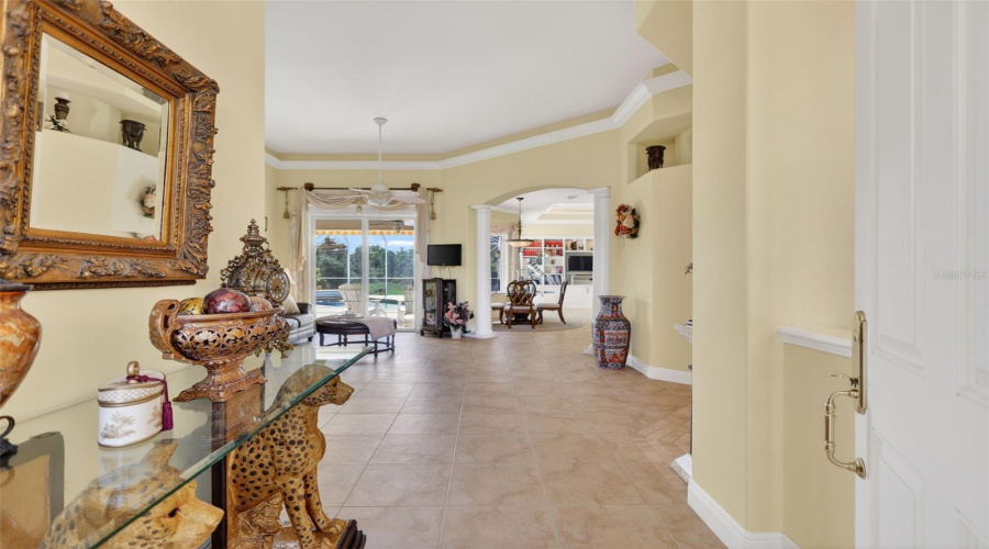 The Welcoming Foyer Introduces The Home'S Open-Concept Design With Soaring 14-Foot Ceilings, Custom Architectural Details, And Seamless Sightlines To The Outdoor Living Areas.