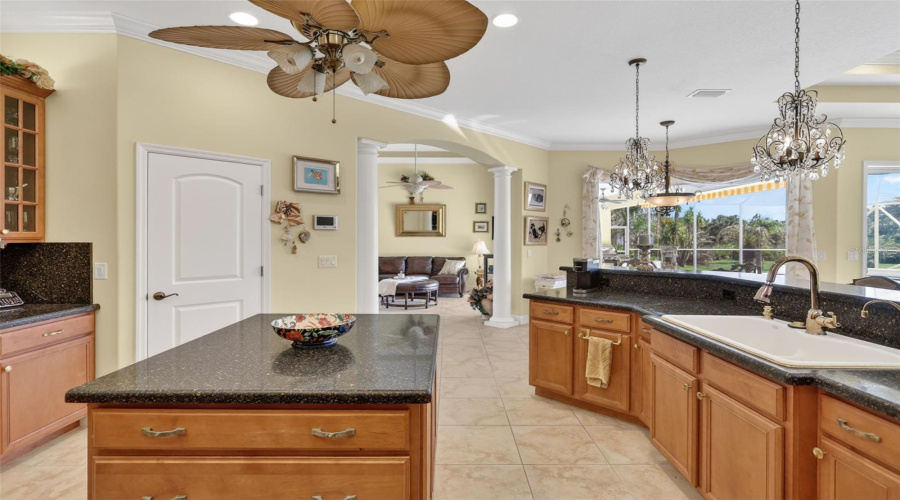 Designed For Both Functionality And Entertaining, The Oversized Kitchen Features Generous Counter Space, A Center Island, Pantry Storage, And Easy Access To The Adjacent Dining And Living Areas.