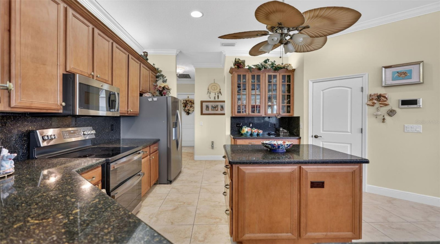 The Well-Appointed Kitchen Combines Abundant Cabinetry, Ample Prep Space, And An Efficient Layout Ideal For Everyday Living And Hosting Guests.