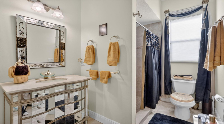 Conveniently Positioned For Guests And Outdoor Entertaining, The Pool Bath Offers Easy Access From The Lanai While Maintaining Privacy And Comfort.