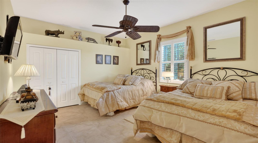 Designed For Both Comfort And Functionality, This Secondary Bedroom Features Abundant Natural Light And Ample Space For Family Or Visiting Guests