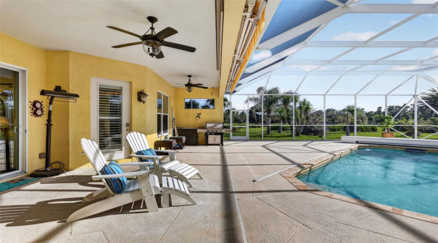 Enjoy Year-Round Outdoor Living With Multiple Gathering Spaces Overlooking The Heated Saltwater Pool And Beautifully Landscaped Acreage.