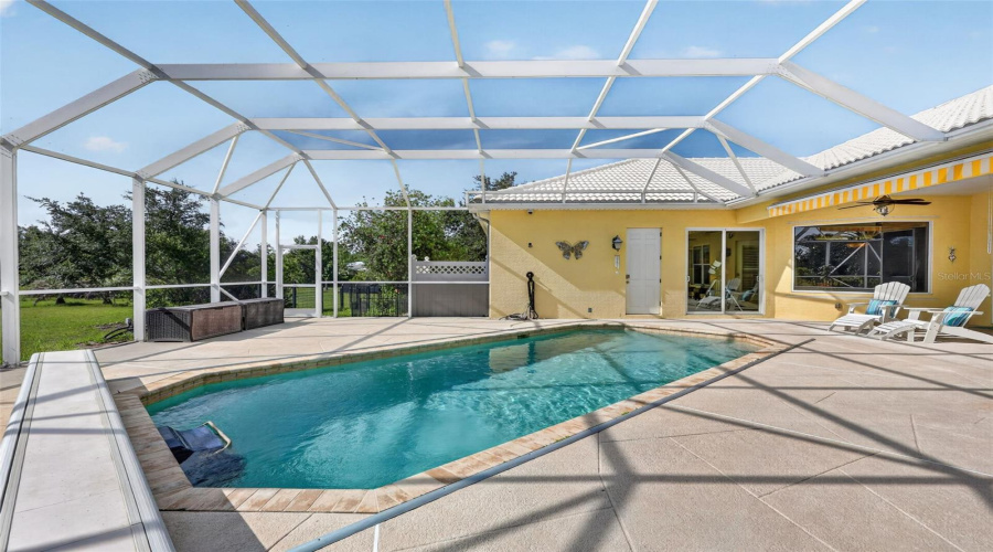 The Screened Lanai And Pool Area Provide A Private Oasis With Generous Deck Space, Scenic Views, And Exceptional Opportunities For Relaxation And Entertaining.