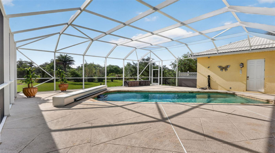 The Expansive Screened Pool Enclosure Offers Exceptional Privacy, Abundant Deck Space, And Peaceful Preserve Views, Creating A True Resort-Style Outdoor Retreat.