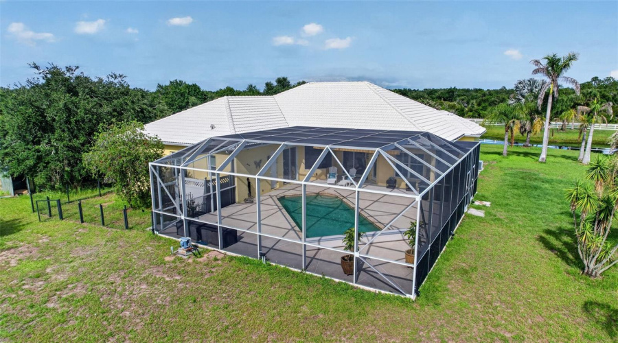 The Oversized Screened Enclosure And Resort-Style Pool Create An Extraordinary Outdoor Living Environment With Abundant Space For Entertaining And Recreation.