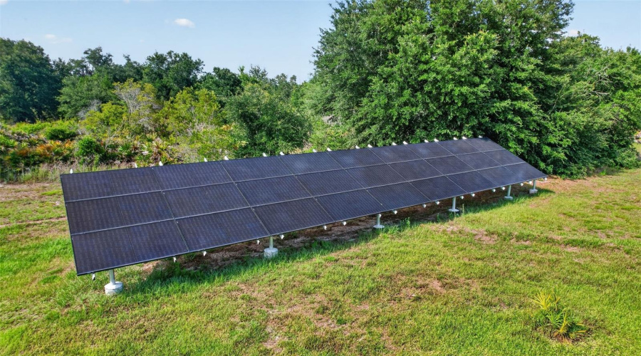 The Owned Ground-Mounted Solar Array Helps Maximize Energy Efficiency While Complementing The Property'S Self-Sufficient Lifestyle Appeal.