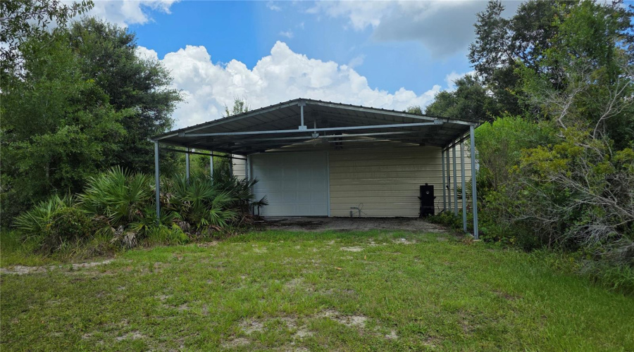 Covered Exterior Workspace Ideal For Projects, Storage, Or Equipment.