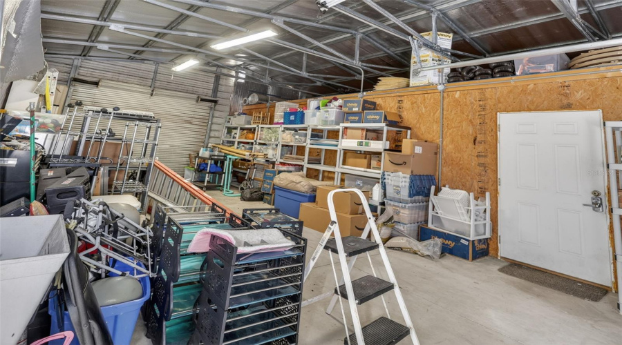 Inside The Workshop You'Ll Find The Pass Through Garage With Entry And Exit Garage Door, Separate Aire Conditioned Space And Utility Tub/Sink.