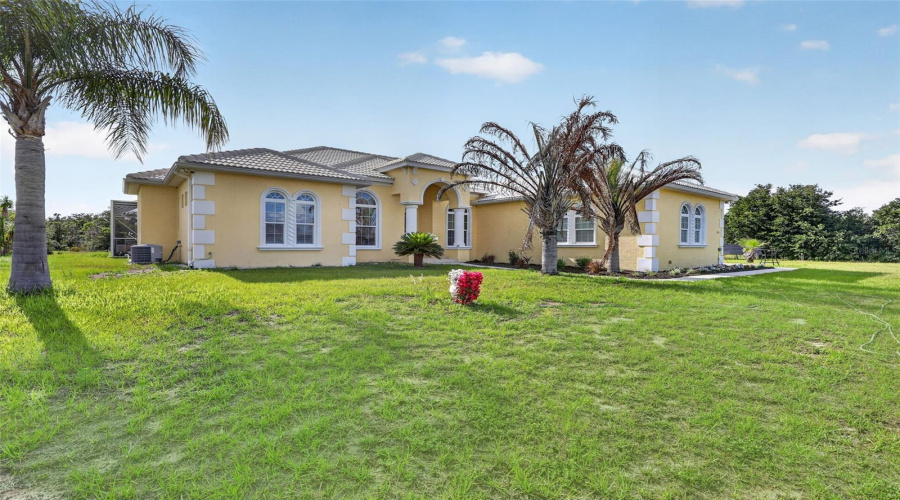 Architecturally Distinctive Custom-Built Estate Featuring A Barrel Tile Roof, Hurricane-Impact Openings, And Nearly Six Private Fenced Acres.
