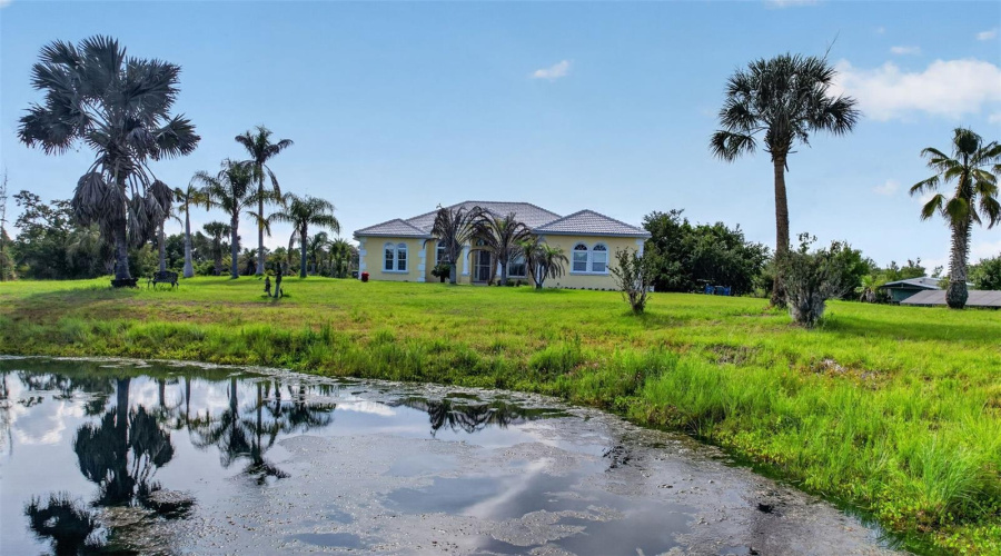 The Private Pond Enhances The Property'S Natural Beauty, Creating A Serene Backdrop And Attracting Local Wildlife.