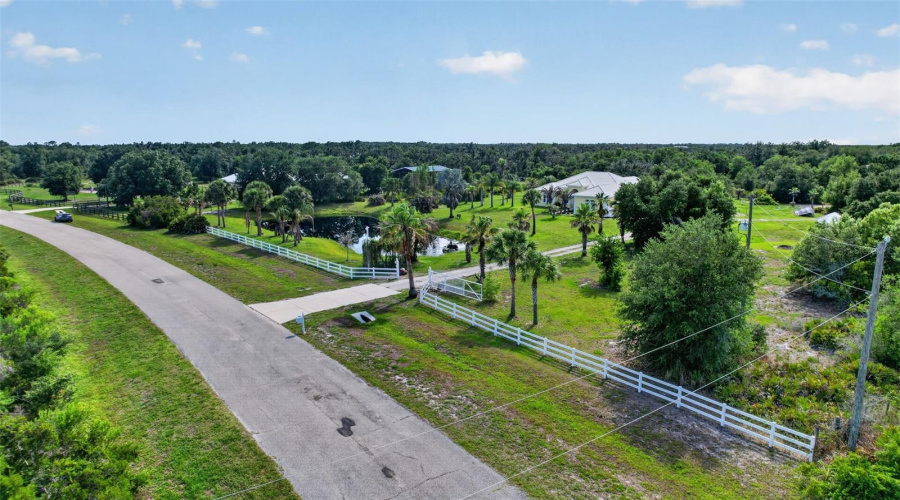 An Expansive Aerial View Captures The Property'S Impressive Acreage, Private Pond, Mature Landscaping, And The Surrounding Rural Landscape That Defines This Exceptional Estate.