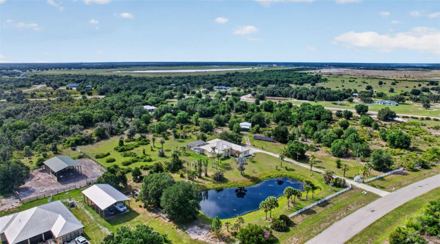 An Expansive Aerial View Showcases The Full Scope Of The Estate, Highlighting The Private Pond, Mature Landscaping, And Over Six Acres Of Peaceful Countryside.