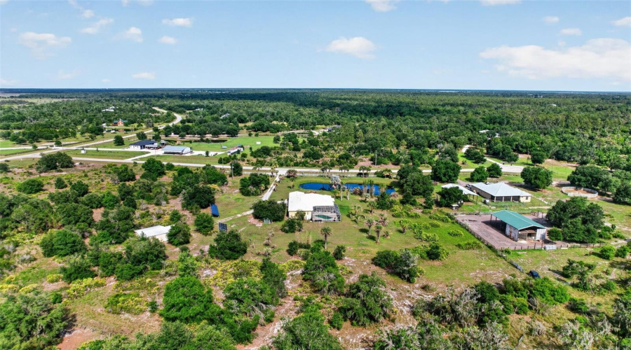 From This Aerial Perspective, The Thoughtful Placement Of The Home, Pool, Outbuildings, And Solar Array Creates A Truly Self-Contained Private Retreat.