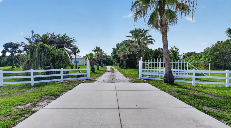 Enter Through The Private Coded Motorized Gate And Experience The Privacy, Security, And Expansive Grounds This Exceptional Estate Offers.
