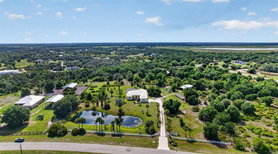 Beautifully Positioned Behind The Private Pond And Gated Entrance, The Residence Offers Exceptional Curb Appeal And A Serene Waterfront Setting.