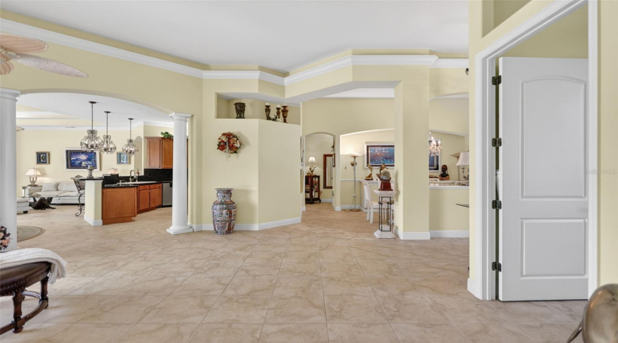 Grand Interior Spaces Showcase Soaring 14-Foot Ceilings, Extensive Crown Molding, Custom Architectural Details, And Tile Flooring Throughout.